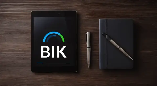 Tablet z logo BIK, długopis i notatnik. Sprawdź, jak sprawdzić czy masz kredyt, korzystając z aplikacji BIK.